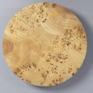 YÖ wall sconce made of mazel wood veneer with soft ambient lighting