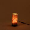 Close up of LIEKKI 20 cm mazel wood veneer table lamp handcrafted detail natural texture