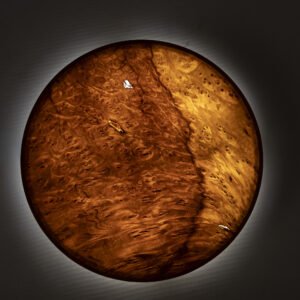 YÖ wall sconce made of laurel wood veneer with soft ambient lighting