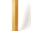 Pine wood floor lamp creating warm ambient lighting in living room