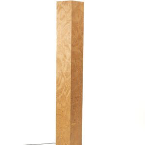 Root wood floor lamp creating warm ambient lighting in modern living room